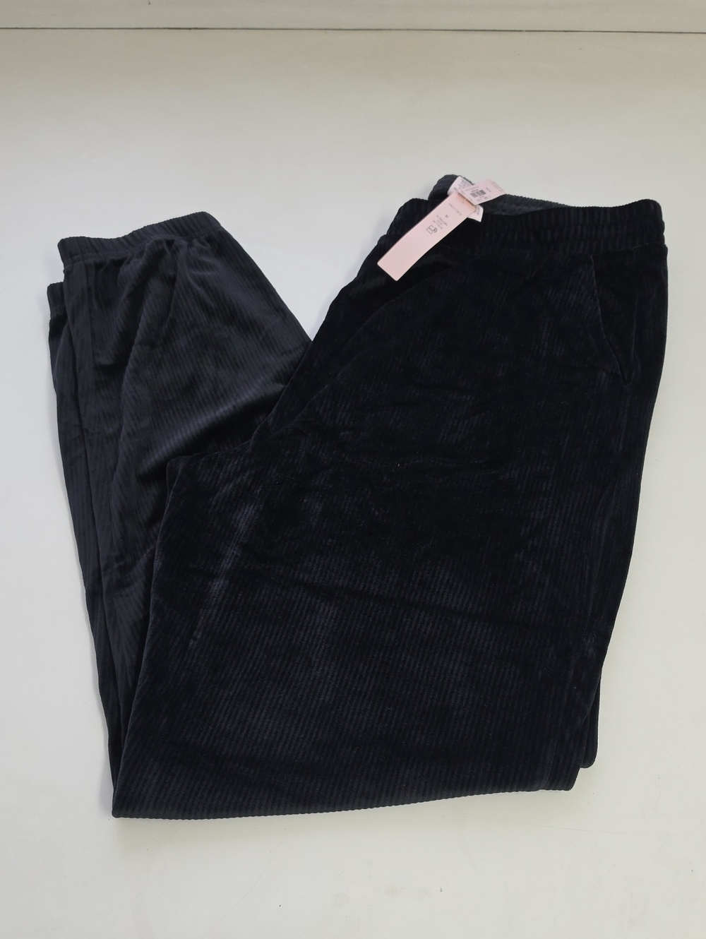 Victoria's Secret black joggers made of ribbed velvet material.
